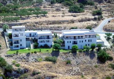 an aerial view of a white house at Roubini Apartments in Falasarna