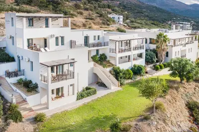 an aerial view of a white apartment building at Roubini Apartments in Falasarna