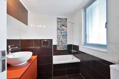 a bathroom with a sink and a bath tub at Calma Seaside Villa in Kalyves
