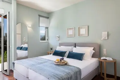 a bedroom with a large bed with a bowl on it at Vilia House on the Hill - Luxury Villa with Heated Pool near Chania in Chania Town