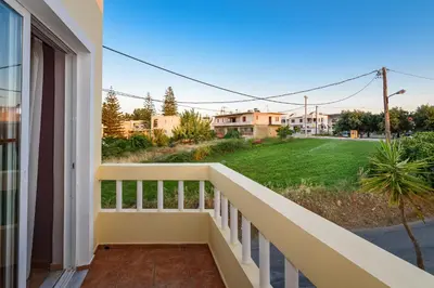 a balcony with a view of a yard at Irinoula Dreams in Kolymvari