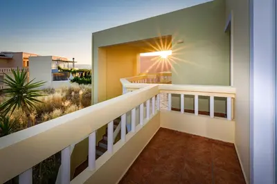 a balcony of a house with a view of the desert at Irinoula Dreams in Kolymvari