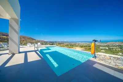 a swimming pool in a villa with a view at Villa Con Vista- Heated Pool 4 bdr sleeps 8 in Tsikalariá