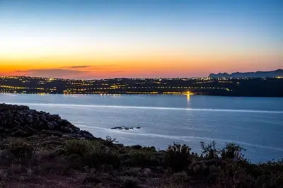 a view of a large body of water at sunset at Margarita Apt - Amazing Relaxing View in Megála Khoráfia