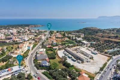 an aerial view of a city and the ocean at Aequor Luxury Rooms & Apartments in Kato Daratso