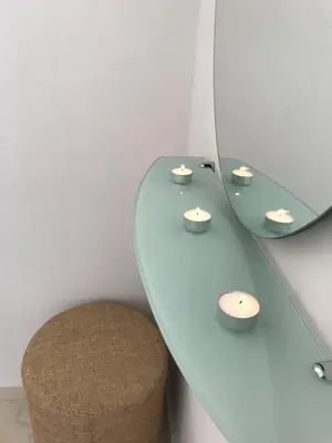 a white table with a chair and a mirror at Omega Comfy Apartments Almyrida in Almirida