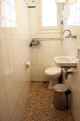 a bathroom with a toilet and a sink at Spacious townhouse close to Chania center in Chania Town
