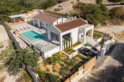 an aerial view of a house with a swimming pool at Villa White Harmony in Khámbatha