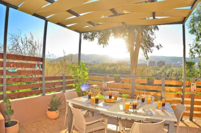 a patio with a table and chairs with a view at Stelios & Stavros Apartment in Kissamos