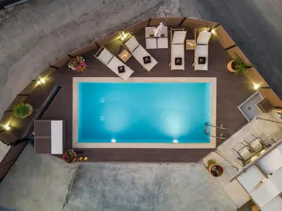 an overhead view of a swimming pool in a building at Villa Roxanne in Galatás