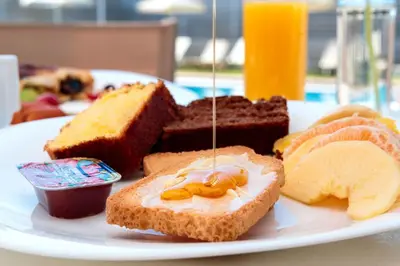 a plate of food with different types of bread at Charming and Comfy House in Agia Marina Nea Kydonias
