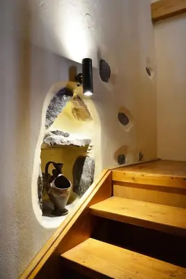 a room with a shelf with a vase on a wall at George & Helen's House in Ayiá
