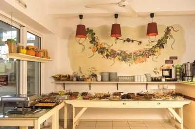 a kitchen with a table with food on it at Manto Studios in Palaiochóra