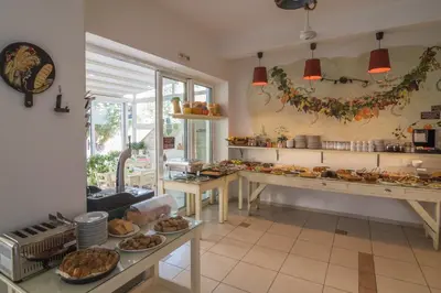 a kitchen with a bunch of food on a counter at Manto Studios in Palaiochóra