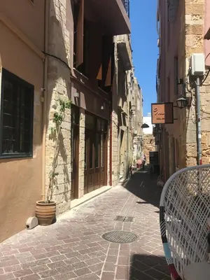 an alley in an old town with a tennis racket at Lito Rooms in Chania Town