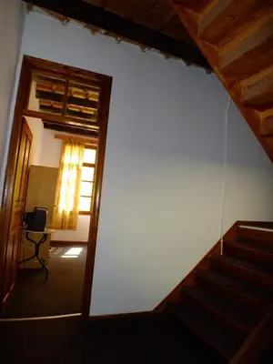 a hallway with a stairway leading to a room at Lito Rooms in Chania Town