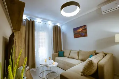 a living room with a couch and a table at Raimonda's House in Chania Town