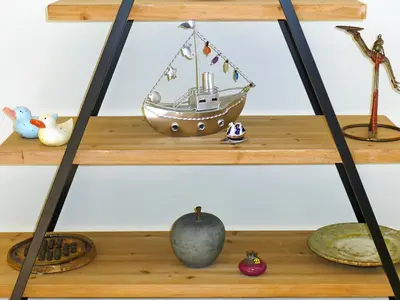 a shelf with a toy boat on it at Maria & Manos Guest House, Agios Onoufrios beach in Agios Onoufrios