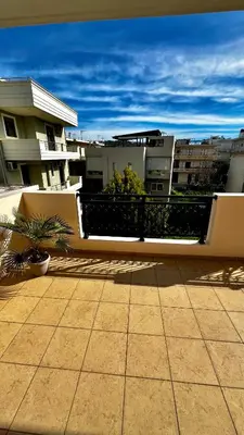 a balcony with a fence and some buildings at Tzitzifianaki Cozy Apartment in Chania Town