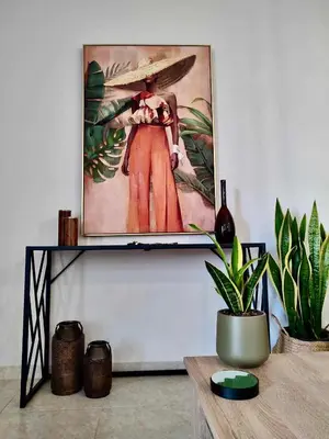 a painting of a woman with a surfboard on a wall at Tzitzifianaki Cozy Apartment in Chania Town