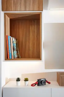 a camera sitting on top of a counter with books at Armi Luxury Apartment in the Heart of the City in Chania Town