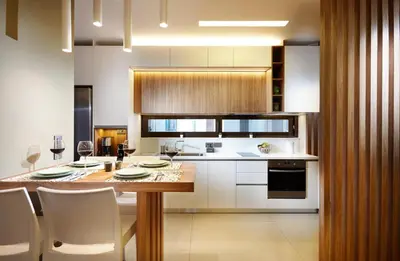 a kitchen with a wooden table and white cabinets at Armi Luxury Apartment in the Heart of the City in Chania Town