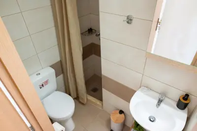a small bathroom with a toilet and a sink at Mare II - Studio in Old Harbor in Chania Town