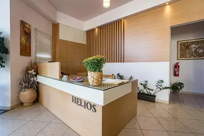 a lobby of a hotel with a helios counter at Helios Apartments in Kato Daratso