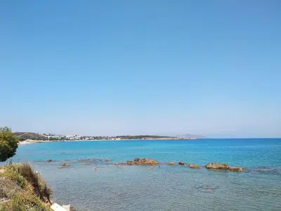 a large body of water with rocks in it at Elita Beachside in Chania Town