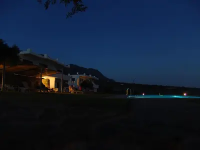 a night view of a building with blue lights at Studios Fokies in Khóra Sfakíon