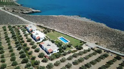 an aerial view of a house with a swimming pool at Studios Fokies in Khóra Sfakíon