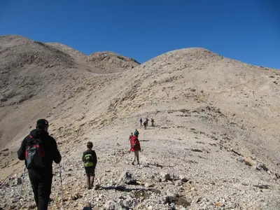 a group of people walking up a mountain at Studios Fokies in Khóra Sfakíon