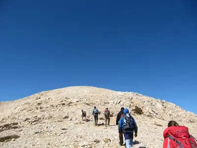 a group of people walking up a mountain at Studios Fokies in Khóra Sfakíon