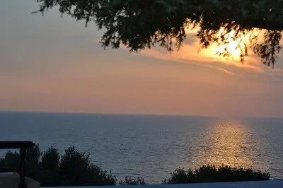 a view of the ocean at sunset at Elafonisi House in Livadia