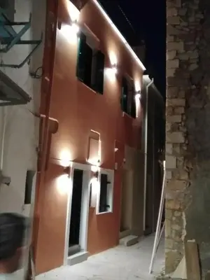 a building with lights on the side of it at Antica Canea Luxury Rooms in Chania Town