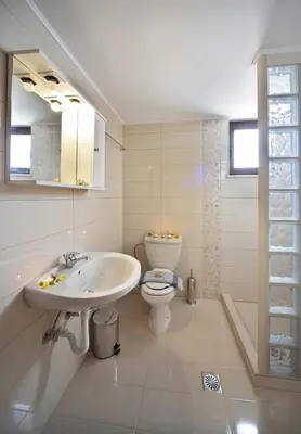 a bathroom with a sink and a toilet at Sfakia Thea Apartments in Sfakiá