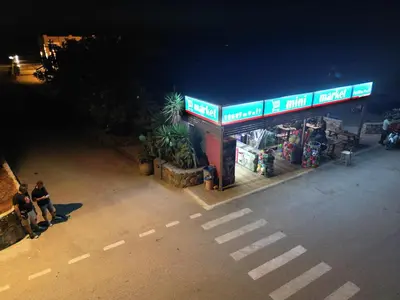 a gas station with people standing in front of it at Elafonisi Paradise with Parking, WiFi, - Walking Distance to the Beach in Elafonisi