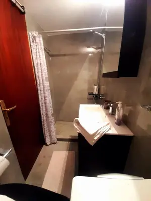 a bathroom with a sink and a shower at Waves House in Kissamos