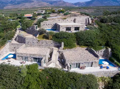 an aerial view of a large stone house at Meliti Sunset View & Private Pool Villa 20 min from Elafonissi in Livadia