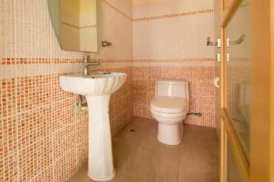 a bathroom with a sink and a toilet at Meliti Sunset View & Private Pool Villa 20 min from Elafonissi in Livadia