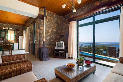 a living room with a view of the ocean at Villa Livadia with Pool, close to Elafonissi famous Beach in Livadia