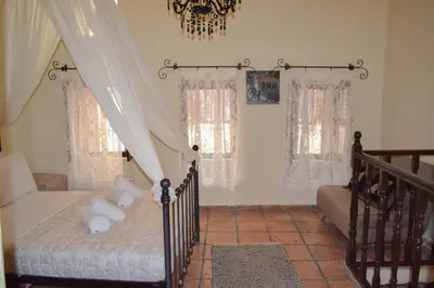 a bedroom with a bed with teddy bears on it at Yro Studios in Chania Town