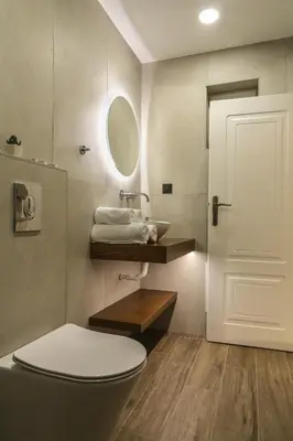 a bathroom with a toilet and a sink at Heaven Apartments in Agia Marina Nea Kydonias
