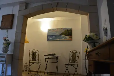 a room with two chairs and a painting on the wall at Poseidon Studios Chania Center in Chania Town