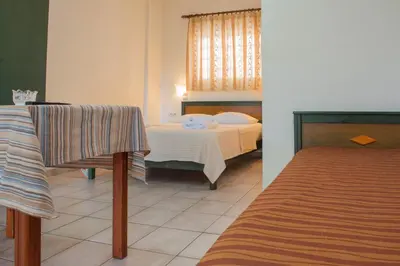 a bedroom with a bed in a room at Virginia Studios in Palaiochóra