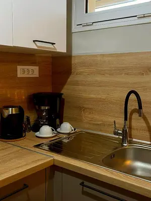 a kitchen with a sink and a counter top at Panos Village in Maláxa