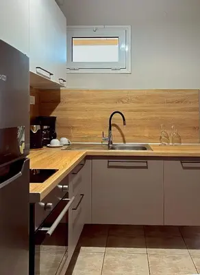 a kitchen with a sink and a counter top at Panos Village in Maláxa