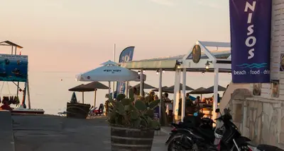 a group of motorcycles parked in front of a restaurant at Ilias Apartments in Plataniás