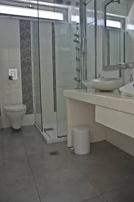 a bathroom with a sink and a toilet at Reveli Estate in Kalathas