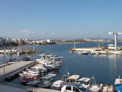 a bunch of boats docked in a harbor at Marika's Guest House Chania in Chania Town